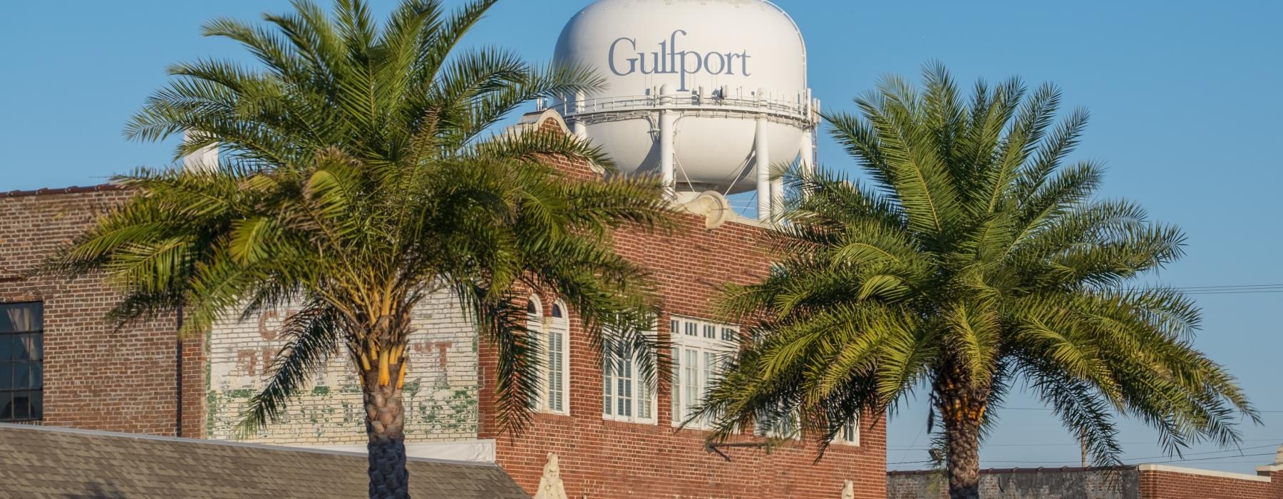 a building with palm trees in front of it