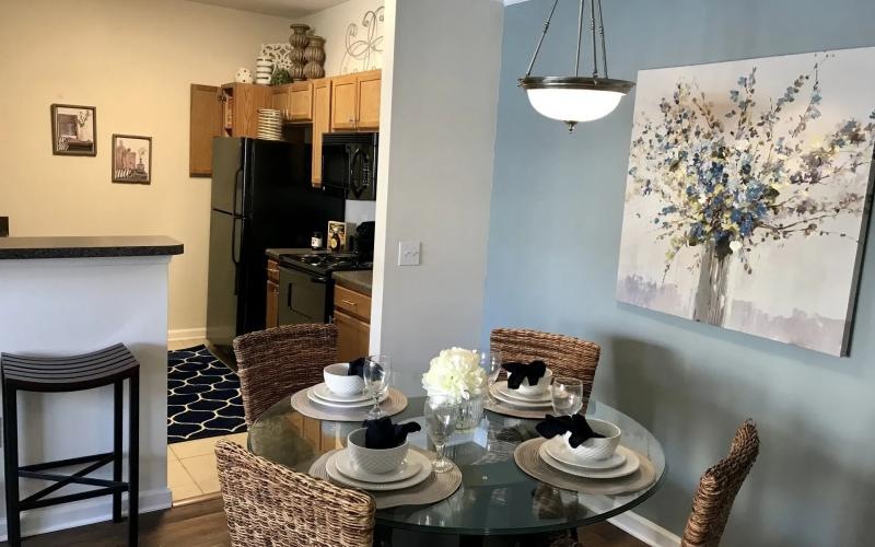 a dining room with a table and chairs